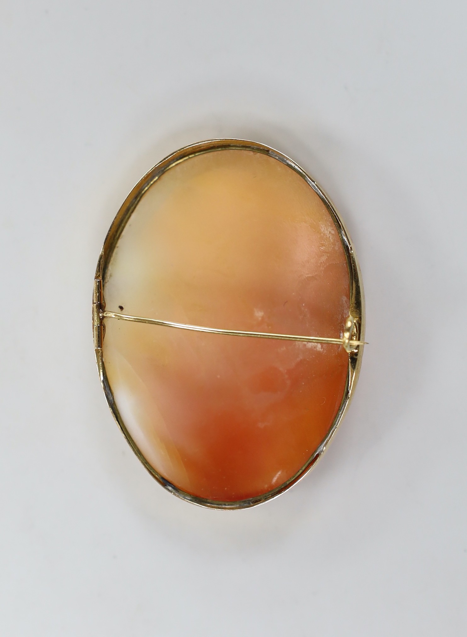 A Swedish 18k mounted oval cameo shell brooch, carved with the bust of a lady to sinister, 51mm.